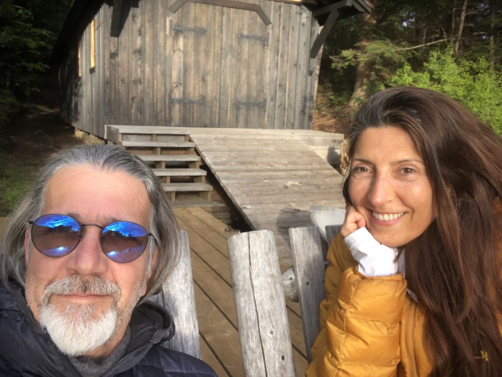 Christianne and husband sitting smiling together